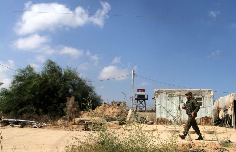 ​A soldier stands guard along the border between Egypt and Gaza, in Rafah, southern Gaza Strip.