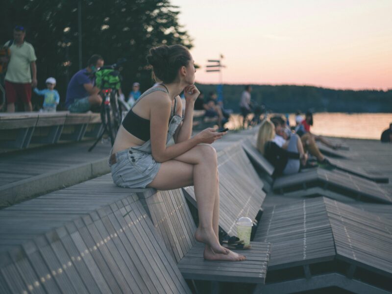 ​A young woman with her phone in Olsztyn, Poland.