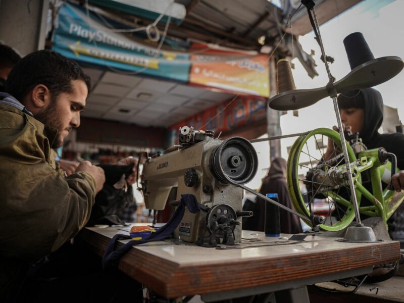 ​Amid power outage in Gaza, tailors use bicycle-powered sewing machine to repair things due to the lack of fuel and electricity.
