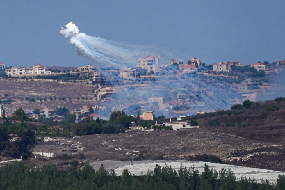 ​An Israeli artillery unit shells southern Lebanon, as seen from northern Israeli border, on Oct. 2, 2024.