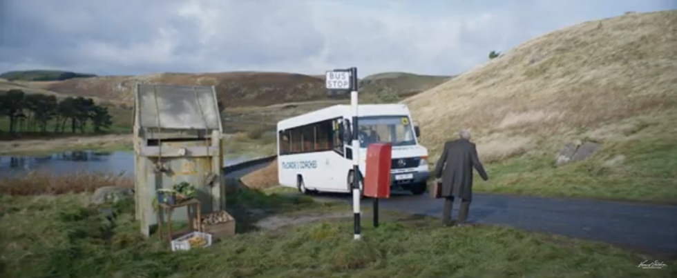 ​An old man taking the bus