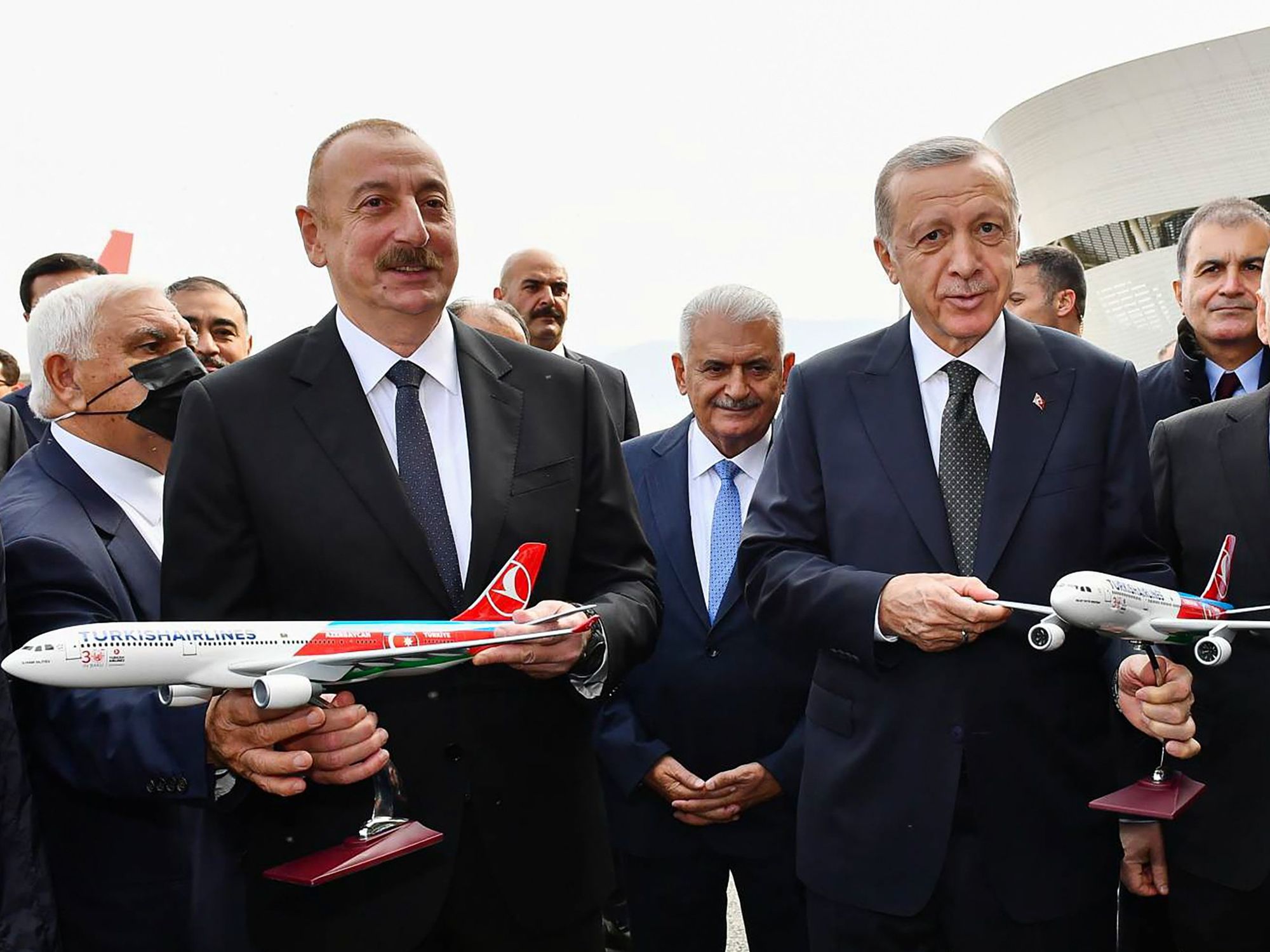 ​Azerbaijan's President Ilham Aliyev and Turkey's President Recep Tayyip Erdogan pose with models of Turkish Airlines aircraft at the opening ceremony of Zangilan International Airport, southwest Azerbaijan.
