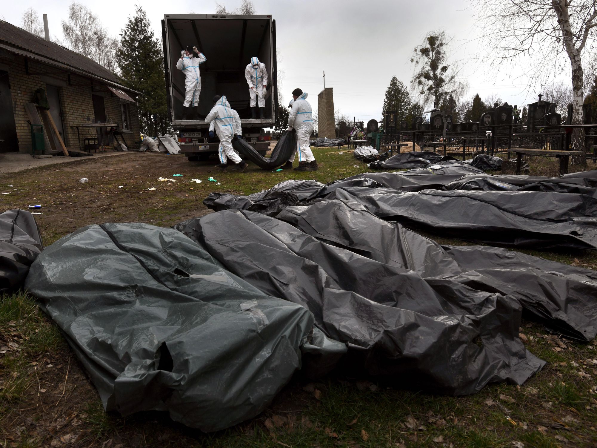 ​Body collectors move bodies to the city morgue as investigators begin the grim task of assessing evidence of war crimes in Bucha