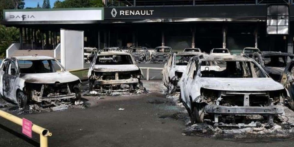 ​Burnt out cars in New Caledonia.