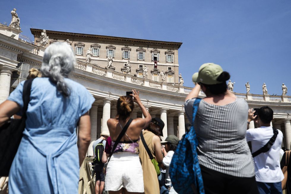 ​Catholics attend Vatican Square during Pope Francis' Angelus prayer in August 2024.