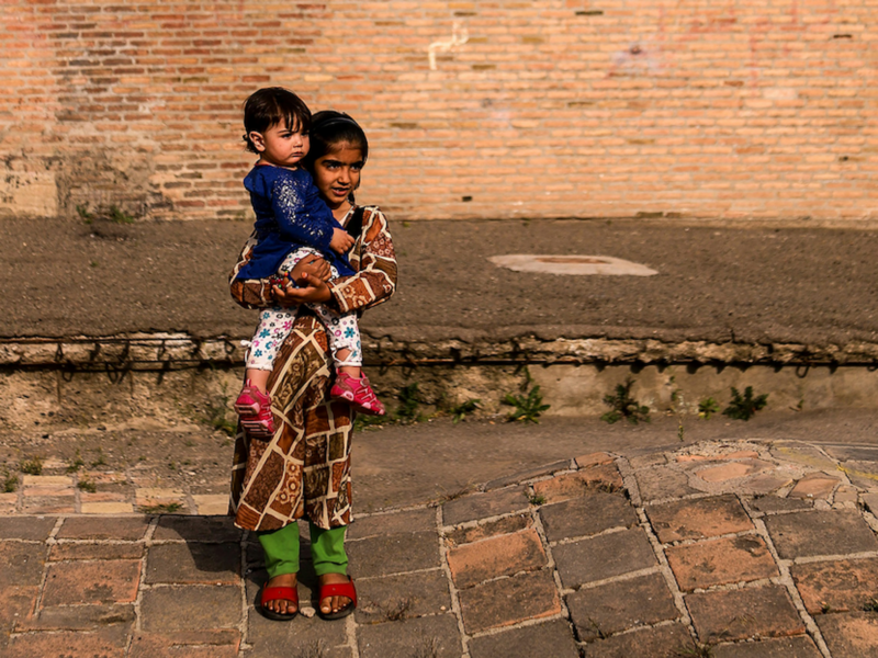 ​Children next to the Jame Mosque of Qazvin, Iran.