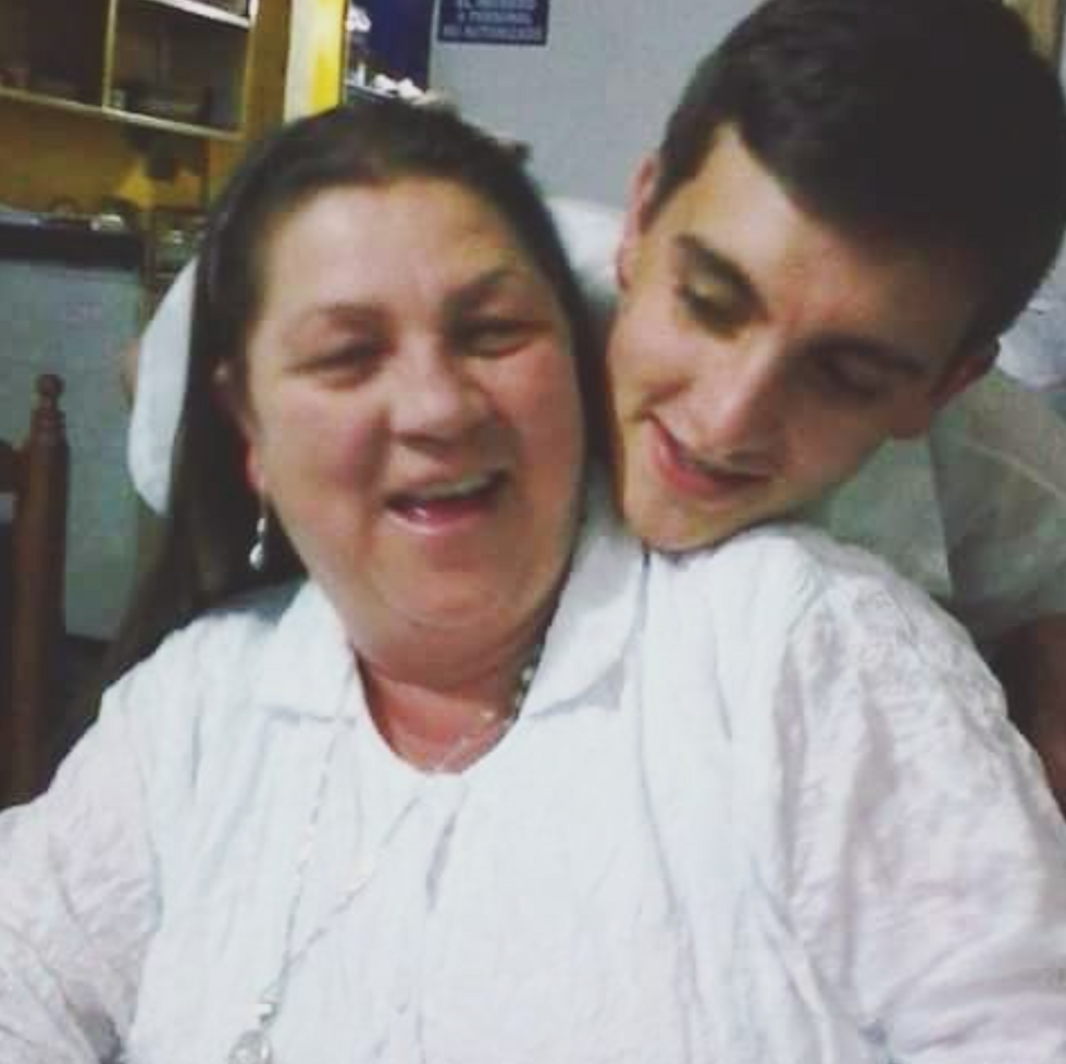 ​David Zuluaga and his mother.