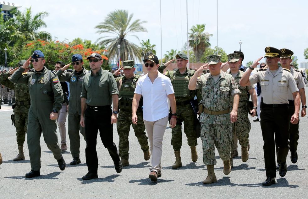 ​Ecuador President Daniel Noboka walking alongside the Minster of National Defense.