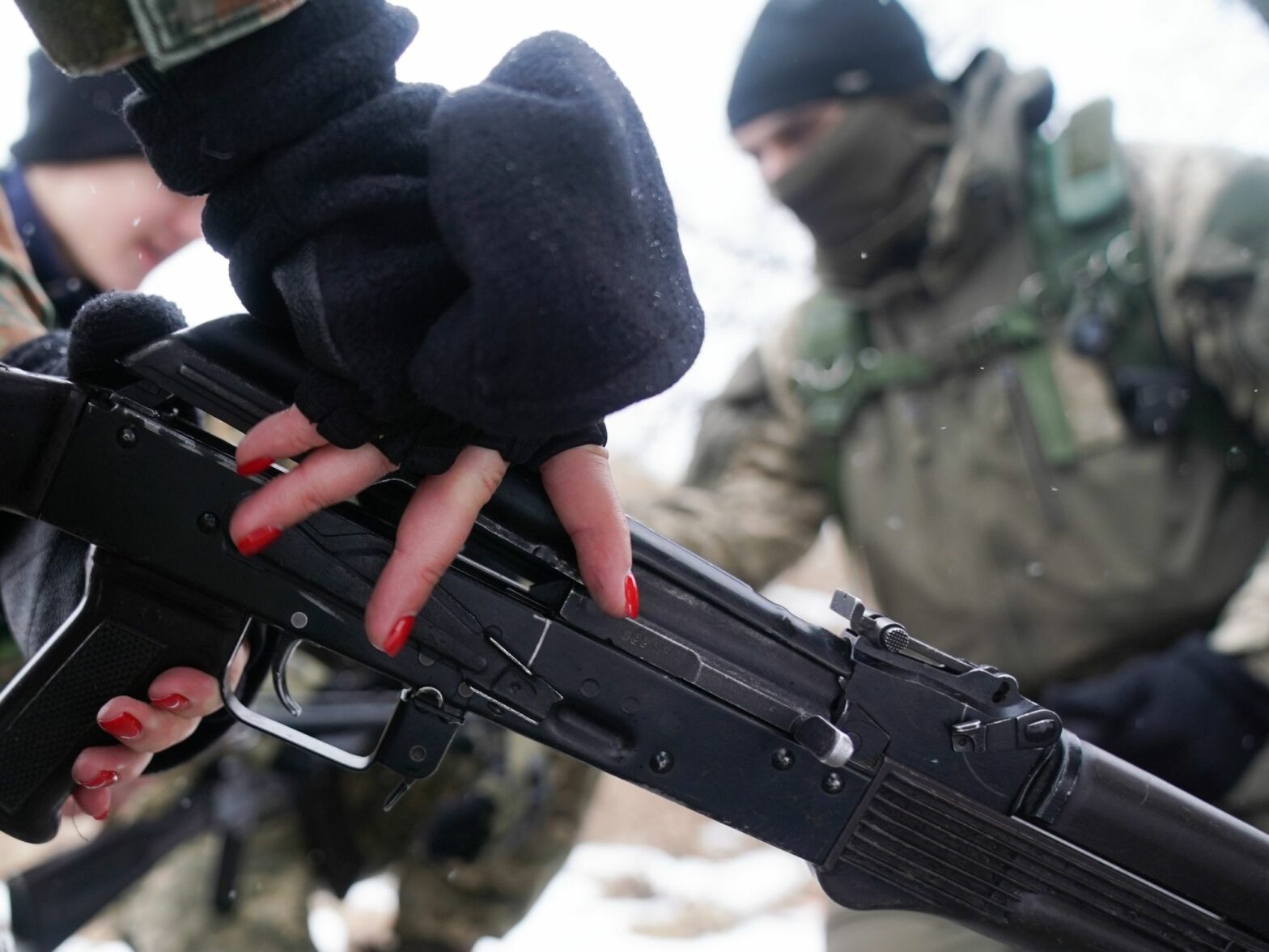​Female trainee soldier wearing red nail polish in Obukhiv, Ukraine