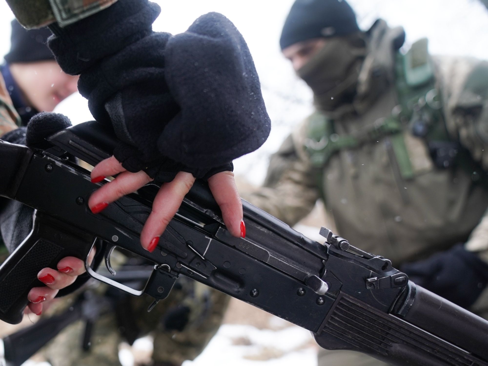 ​Female trainee soldier wearing red nail polish in Obukhiv, Ukraine