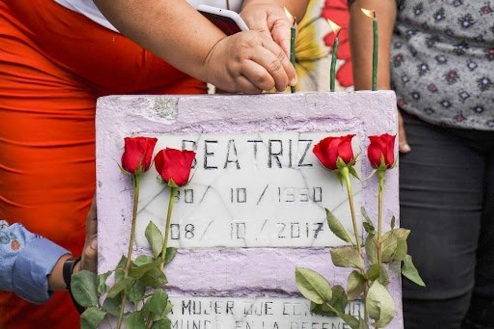​Feminist demonstrators place candles on a memorial for Beatriz, a woman who died during pregnancy for being denied an abortion during a demonstration on International Safe Abortion Day in San Salvador.