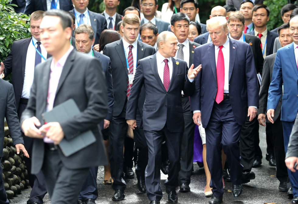​File photo of ​Vladimir Putin and Donald Trump walking and talking together at the APEC Economic Leaders’ Meeting back in 2017.