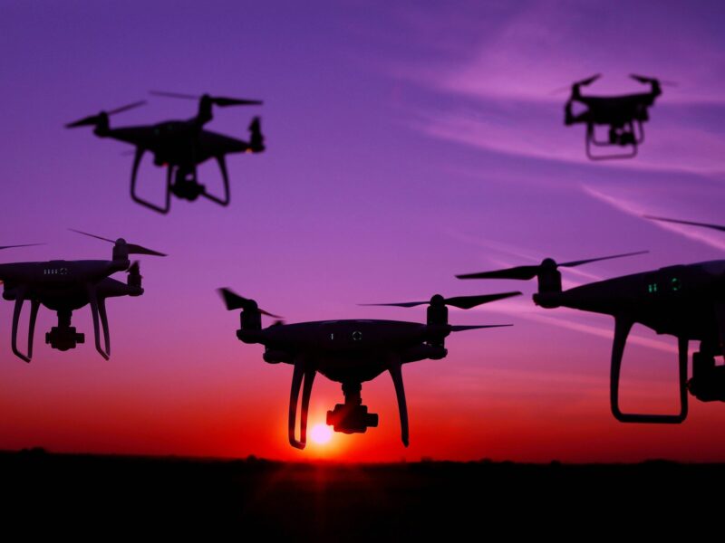 ​Five drones in the sky at sunset