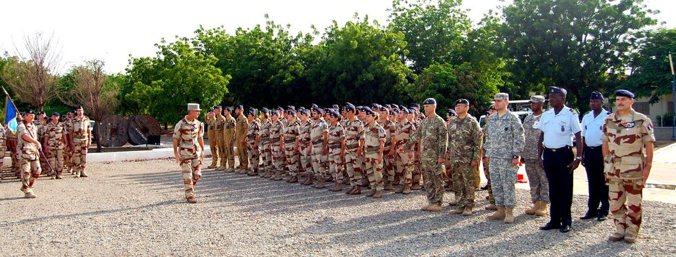 ​French and Chad military participate in a flag ceremony to commemorate the launch of Operation Barkhane.