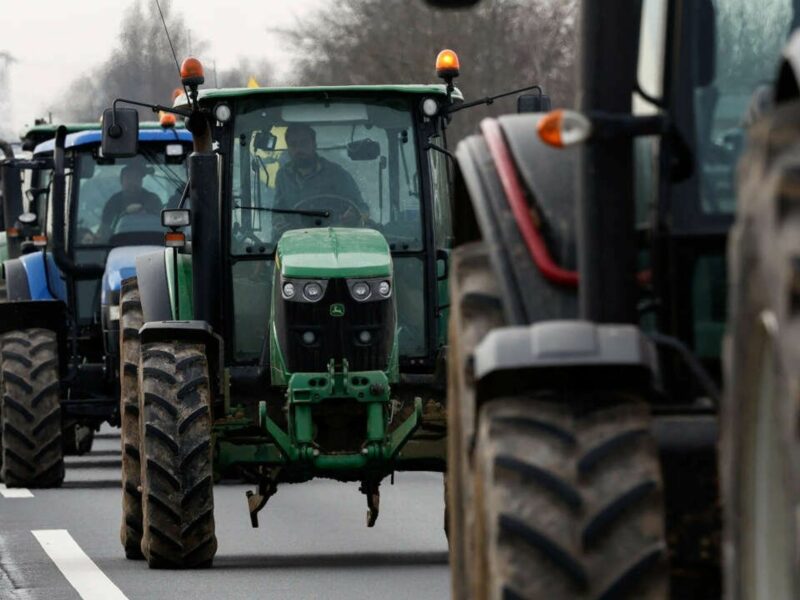 ​French Farmers use their tractors to distrupte traffic.