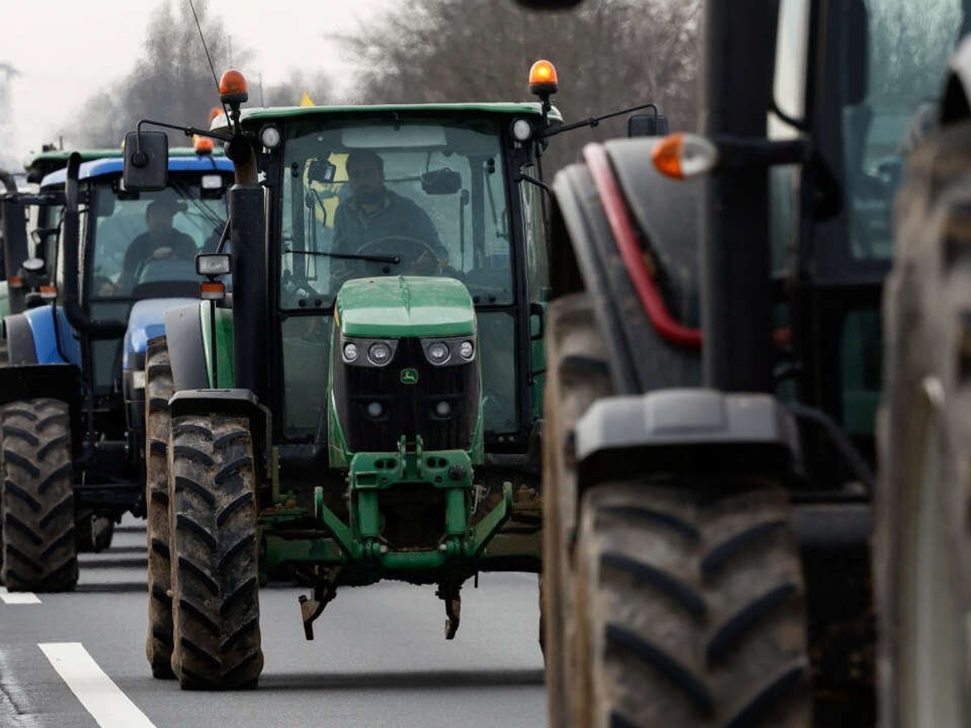 ​French Farmers use their tractors to distrupte traffic.