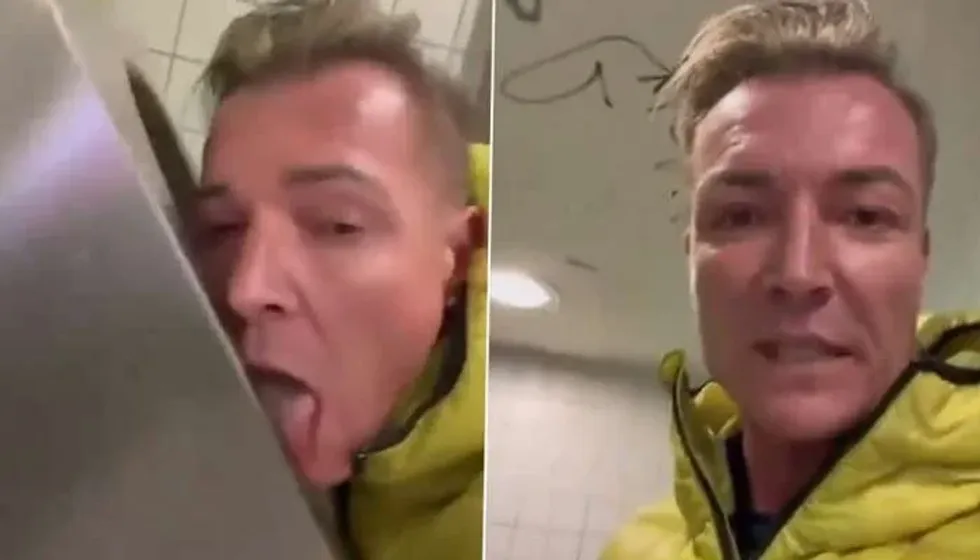 ​German politician, Martin Neumaier, licking a toilet seat.
