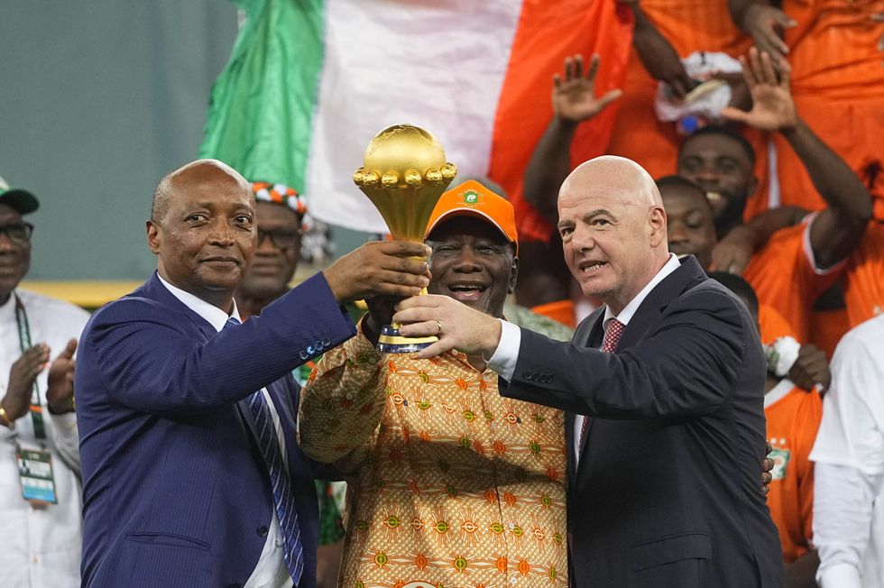 ​Giovanni Vincenzo Infantino, Alassane Dramane Ouattara and Patrice Motsepe looks on during African Cup of Nations.