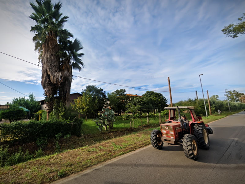 ​Google Street view screenshot of a tractor driving in Borgo Santa Maria, Latina
