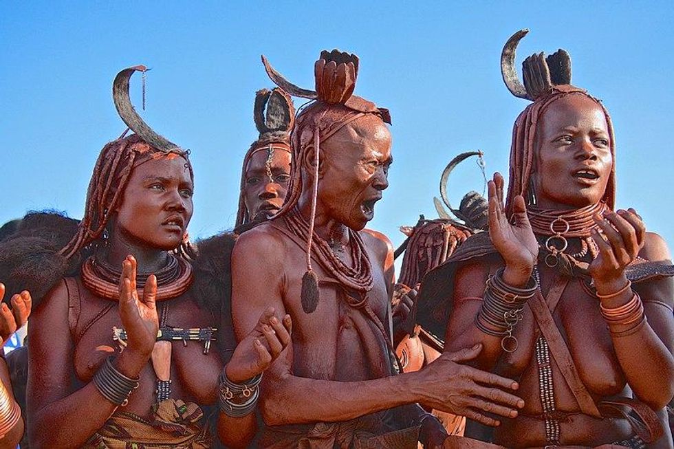 ​Himba's tribe women in ceremony, Namibe, Angola