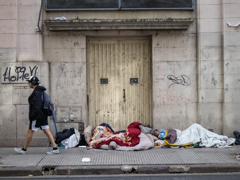 ​Homeless people sleep in front of the entrance to a building, Argentina, Buenos Aires, June 4, 2024.