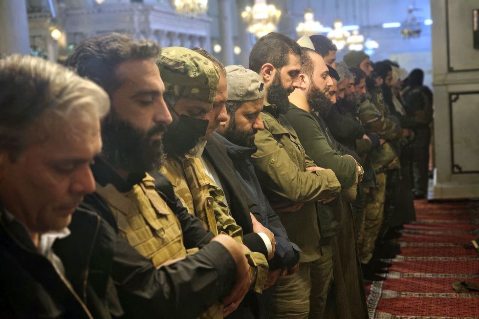 ​HTS (Hayaat Tahrir Al Sham) leader Ahmed Al-Shara, also known as Abu Muhammad Al-Jolani, commander in the operations department of the Syrian armed opposition praying inside the Great Umayyad Mosque after his troops declared their entry into the capital and the overthrow of Bashar Al-Assad, in Damascus, Syria, Dec. 9, 2024.