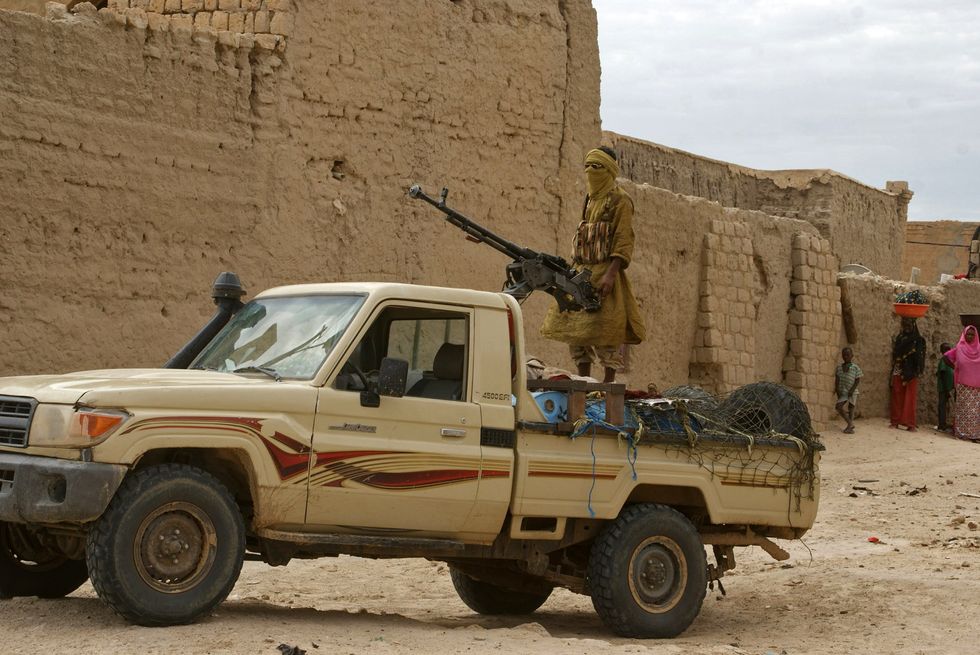 ​Islamists on the back of a truck with a large machine gun in Mali.