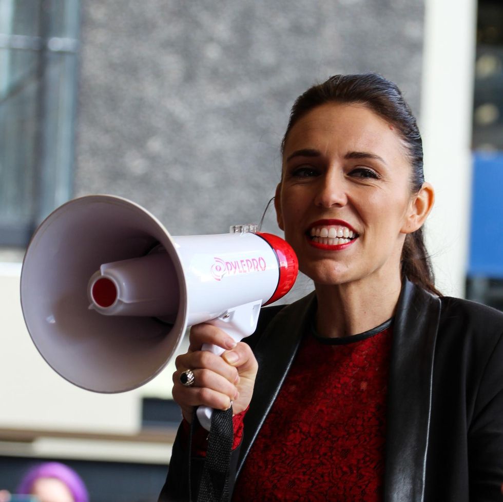 ​Jacinda Ardern, leader of the NZ Labour party holding a microphone, at the University of Auckland Quad on September 1st 2017