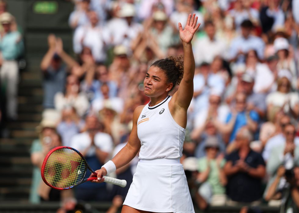 ​Jasmine Paolini waves to the spectators after defeating Donna Vekic