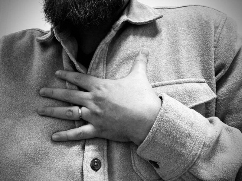 ​Man holding his hand on his chest, Dec. 5, 2024.