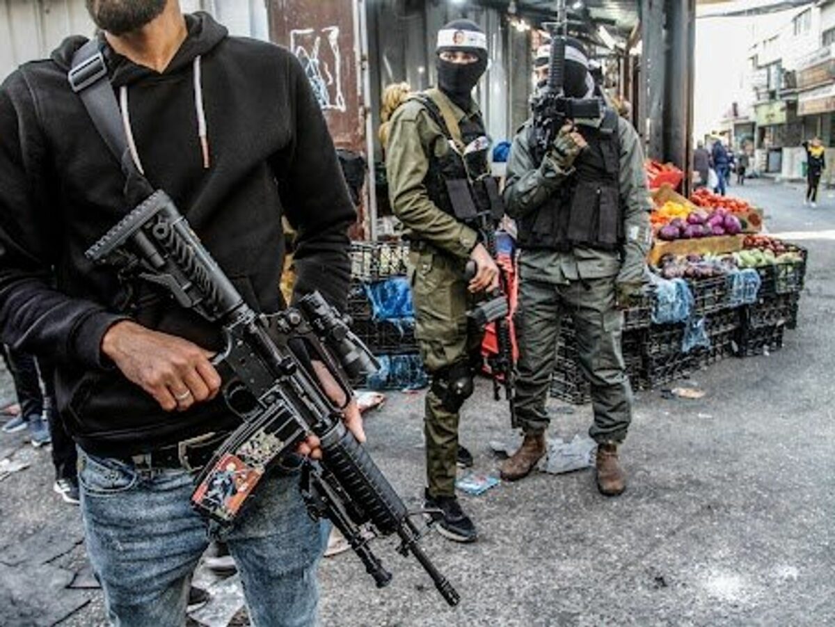 ​Masked Palestinian gunmen from the Al-Aqsa Martyrs Brigades of the Fatah movement led by President Mahmoud Abbas seen carrying their weapons during the demonstration for the Palestinians who were shot dead by the Israeli army this year, in Balata refugee camp, east of Nablus, in the occupied West Bank.