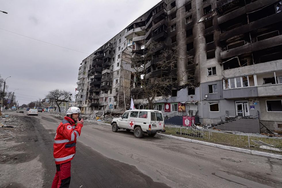 ​Member of the Red Cross in a bombarded street, Ukraine
