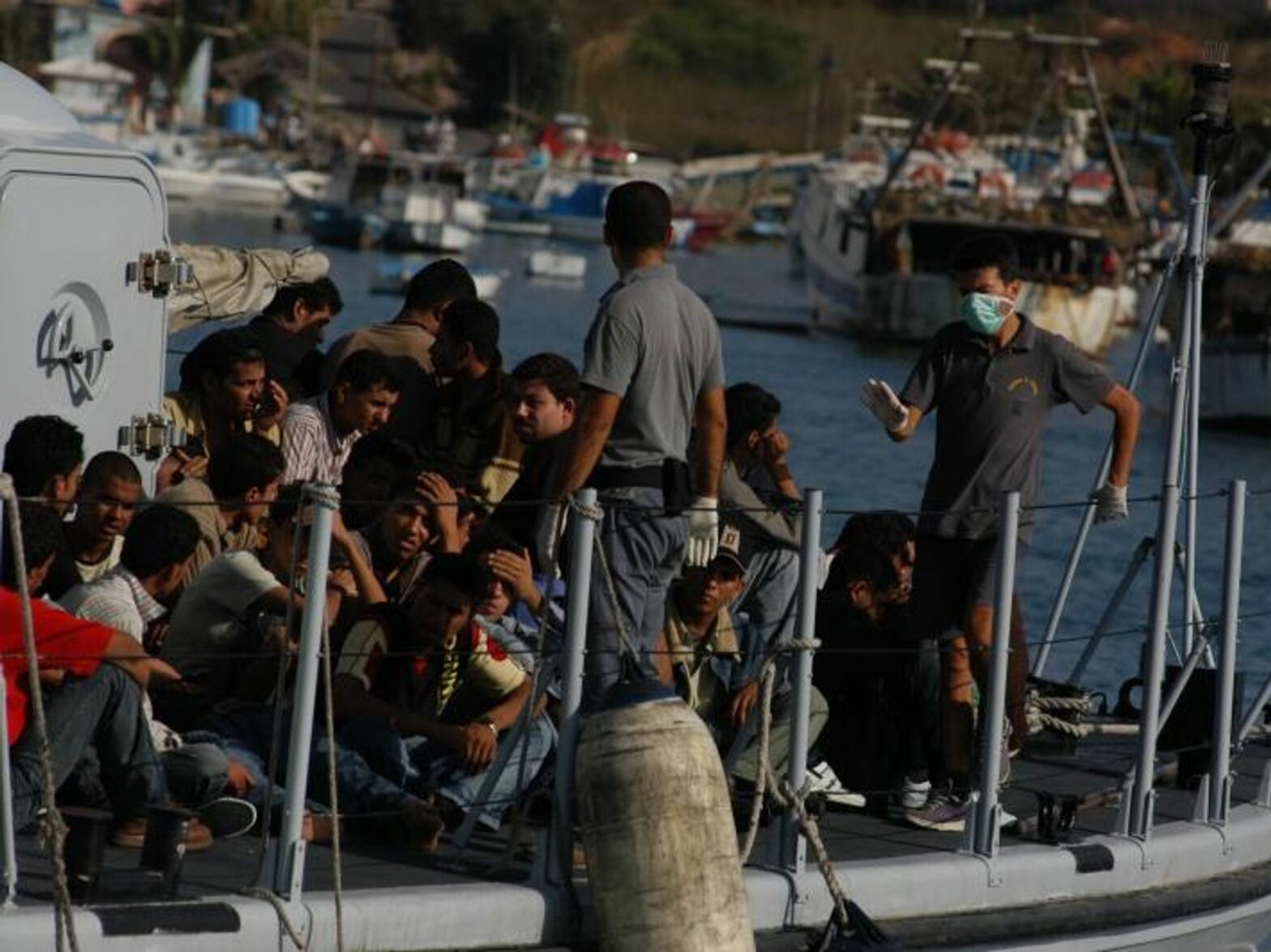 ​Migrants arrive on the island of Lampedusa