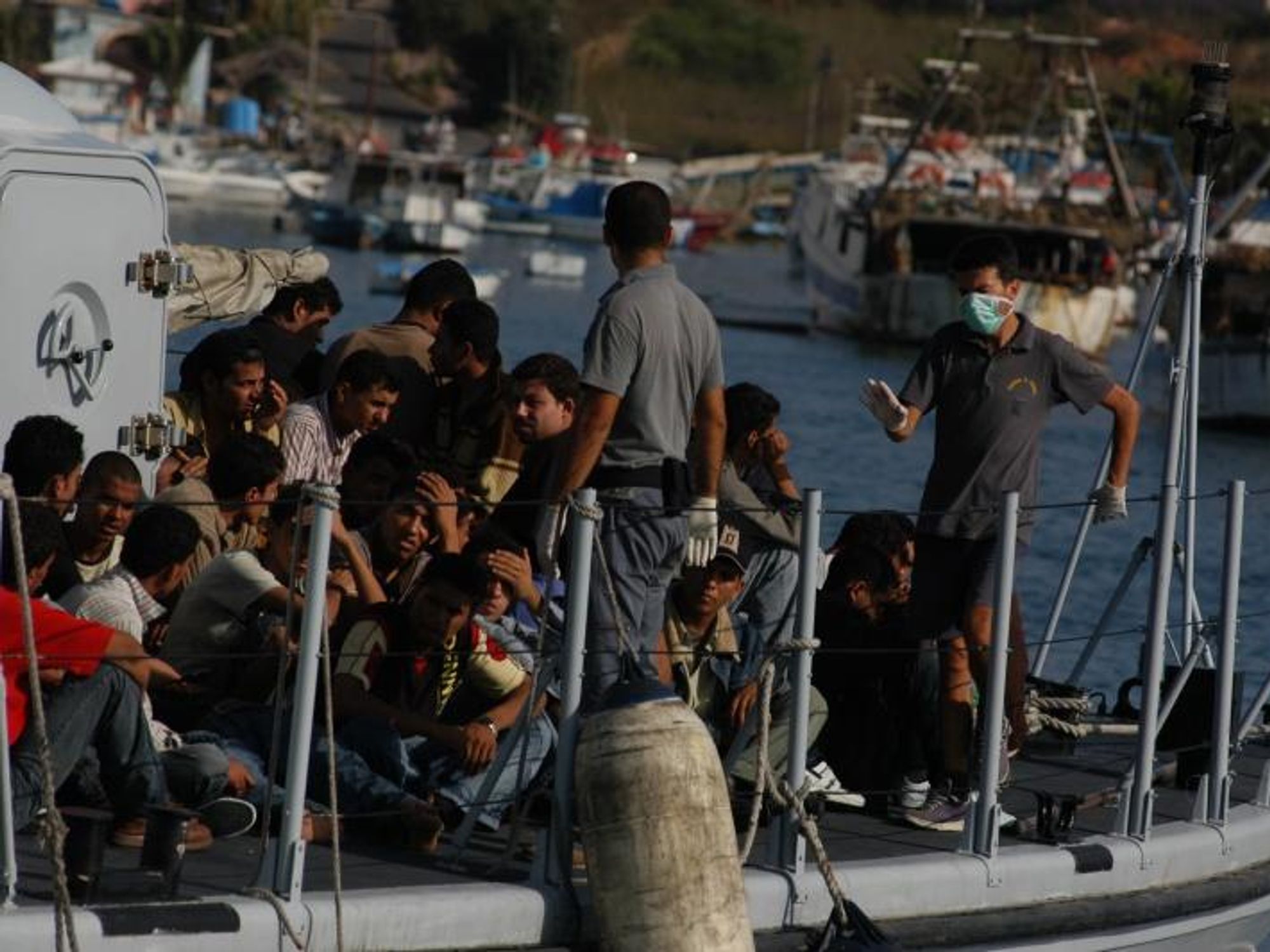 ​Migrants arrive on the island of Lampedusa