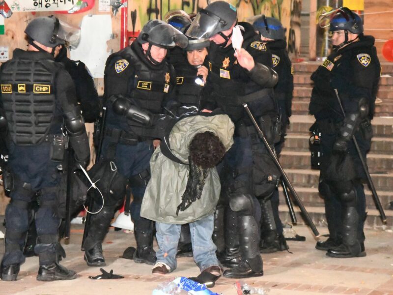 ​One of many arrests made by CHP officers in riot gear to take down a pro-Palestinian encampment on the UCLA campus.