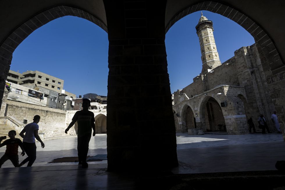 ​Palestinians at the Omari Mosque, one of the oldest archaeological sites in Gaza City.