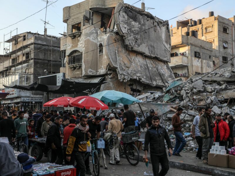​Palestinians displaced from their homes go to the market to buy sweets and traditional cakes in Rafah, in preparation for Eid al-Fitr.