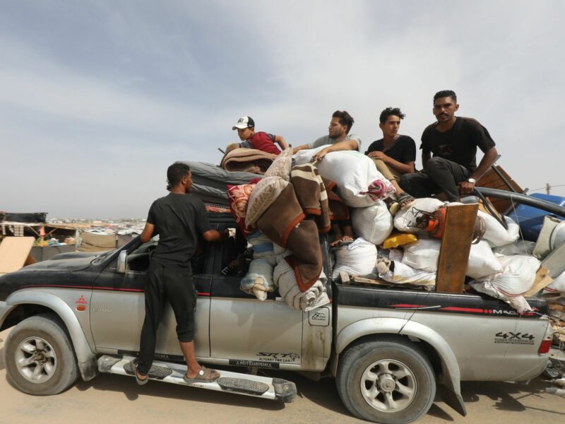 ​Palestinians fleeing unsafe areas in Rafah arrive with their belongings on Trucks and cars in Khan Yunis, further north in the southern Gaza Strip.