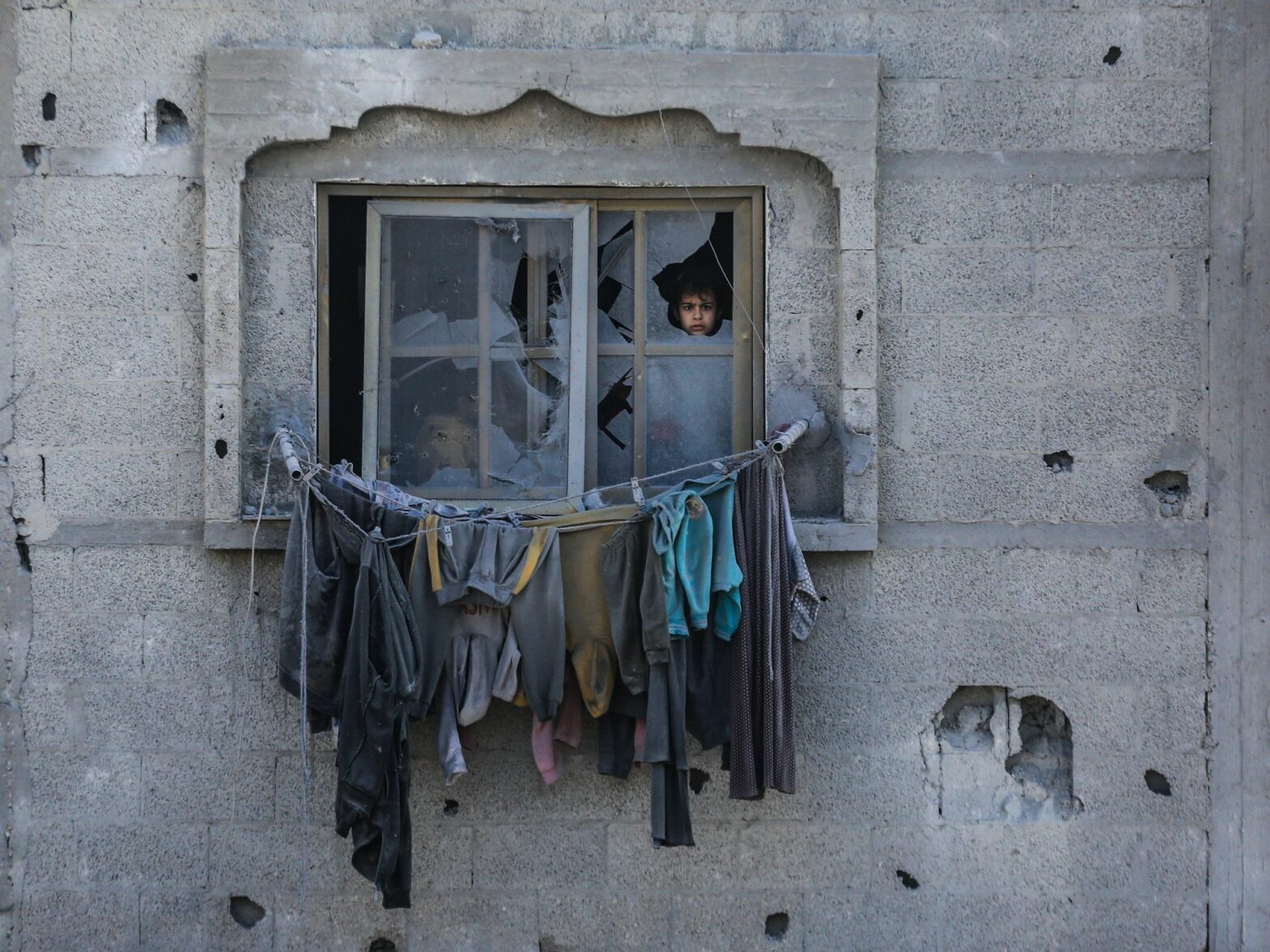 ​Palestinians inspect the damages of their home, which was bombed by Israeli army aircraft at dawn today in the city of Rafah