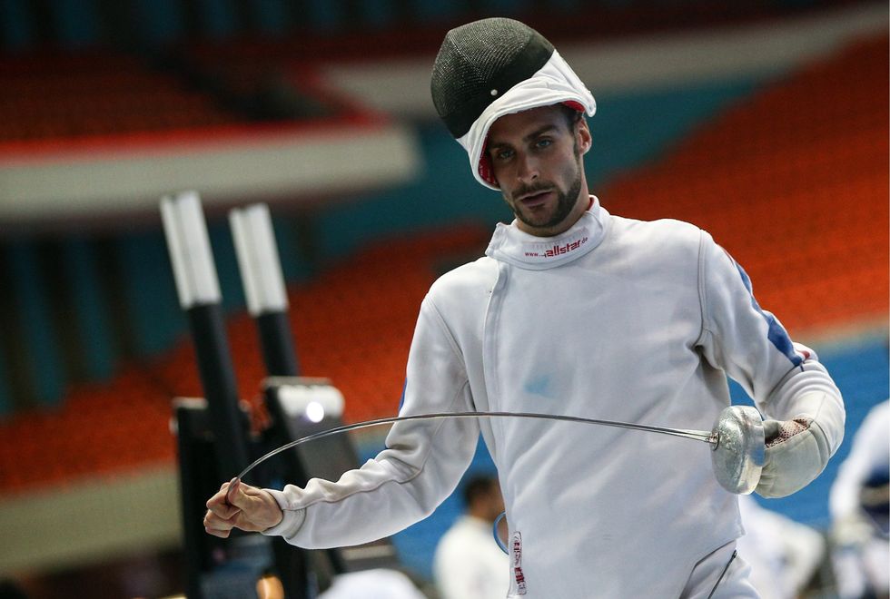 ​Pentathlete Valentin Belaud of France competes in the fencing event of men's individuals.