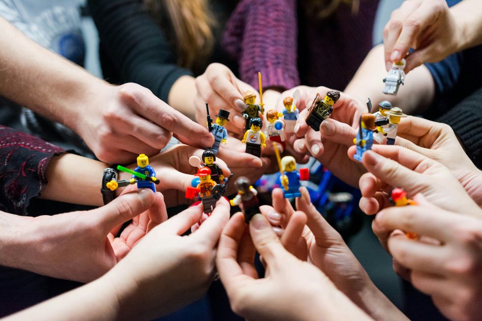 ​People holding Legos