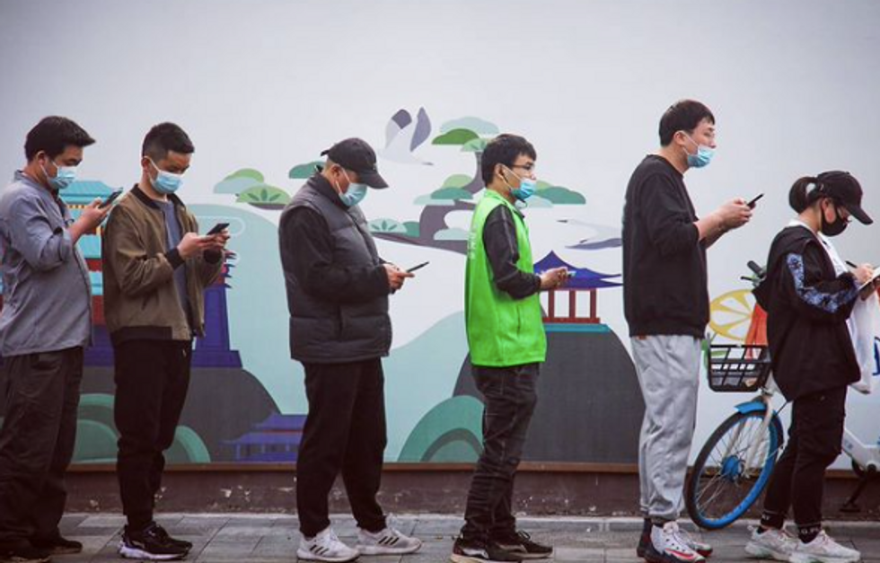 ​People queue for mass testing in Shanghai