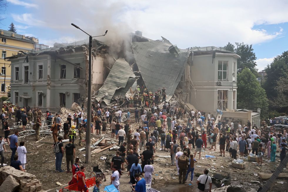​People search for victims after the Russian army launched a rocket attack on the ''Ohmatdyt'' children's clinic.