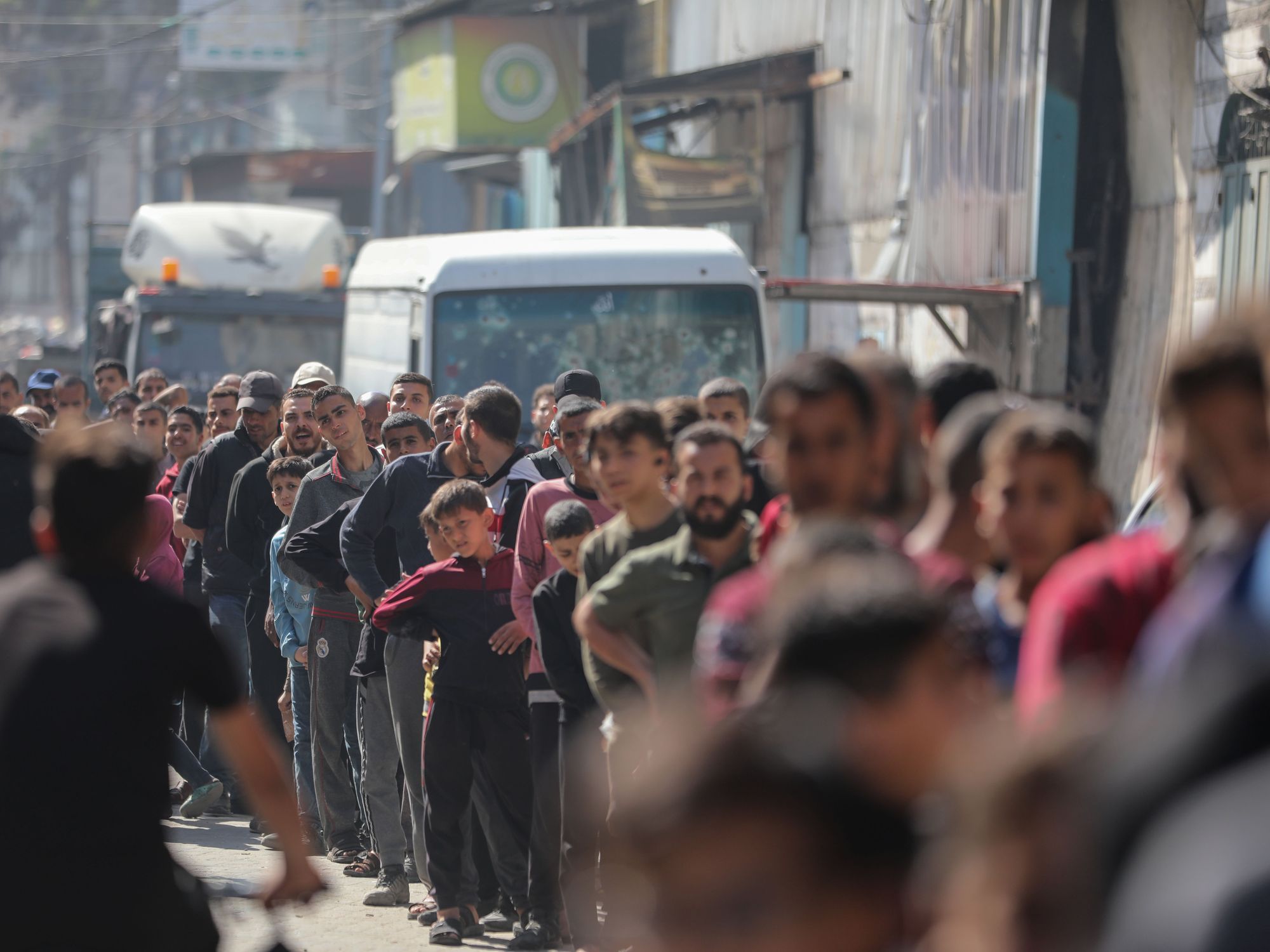 ​People wait to receive bread at a bakery in Gaza City on April 14, 2024.