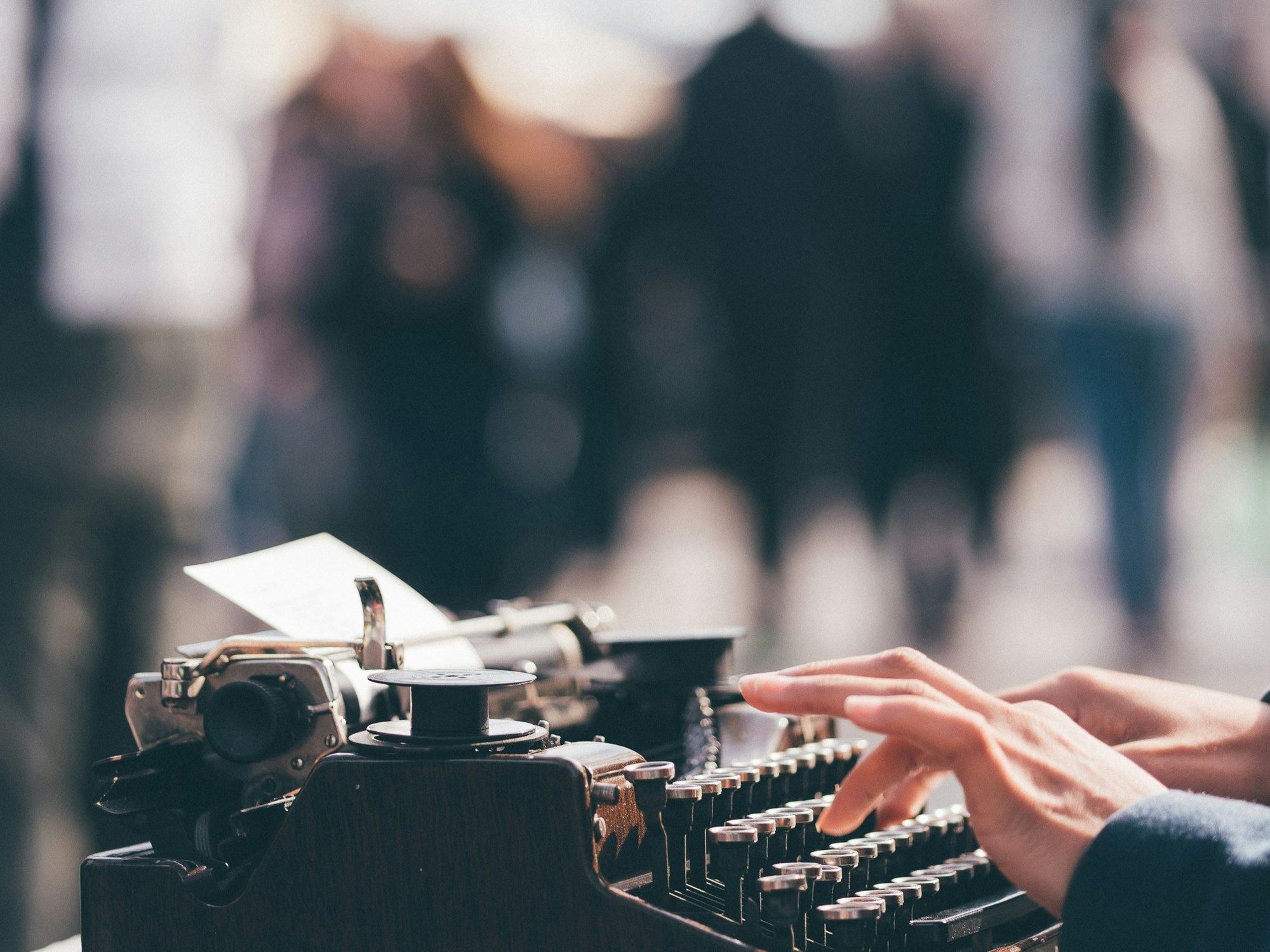 ​Person using a old typewrtier.