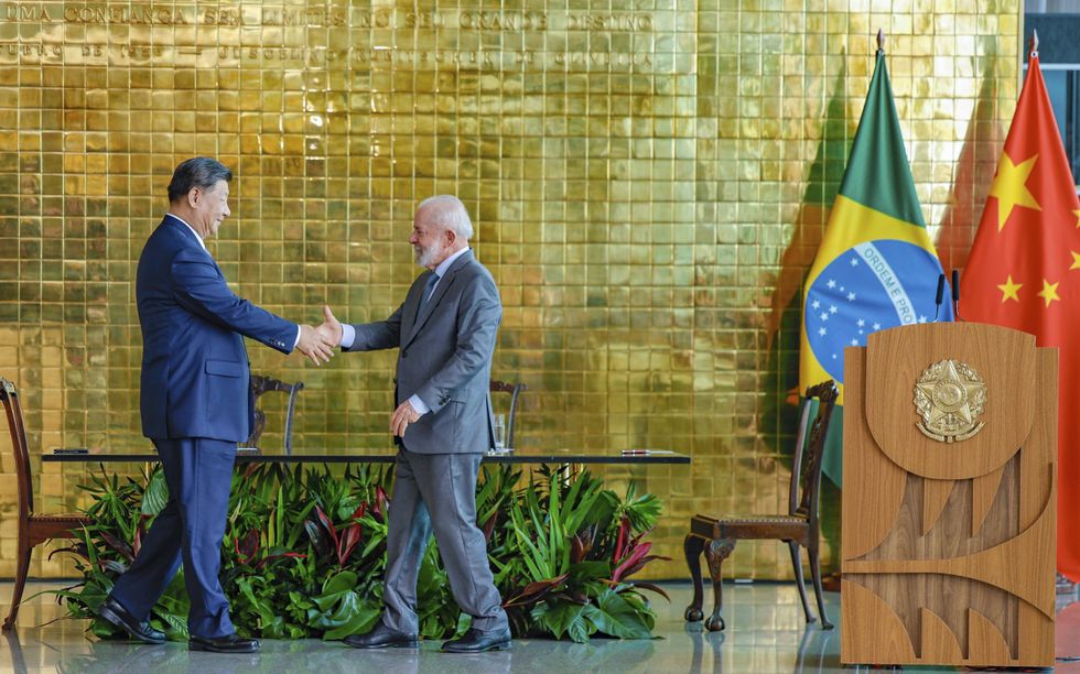 ​President Luiz Inacio Lula da Silva, right, shakes hands with Chinese President Xi Jinping, left, during a signing ceremony at the Alvorada Palace, Brasilia, Brazil, Nov. 20, 2024.