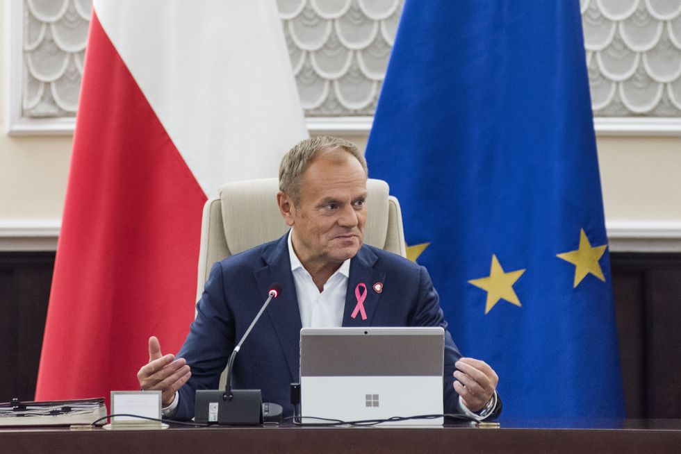 ​Prime Minister Donald Tusk speaks during a government meeting, discussing Poland's government migration strategy for 2025-2030.