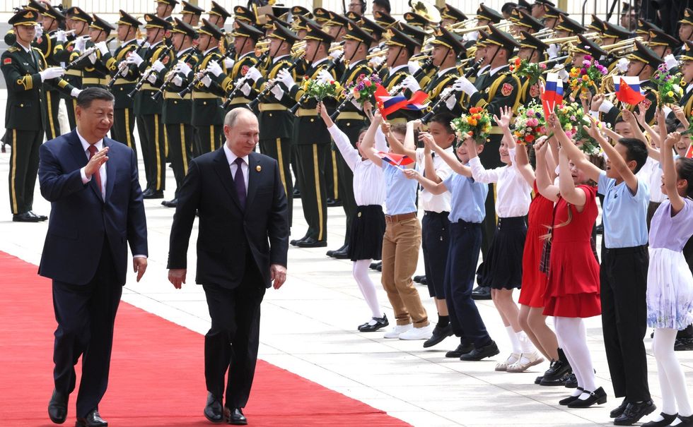 ​Russia's President Vladimir Putin and China's President Xi Jinping attend an official welcoming ceremon.