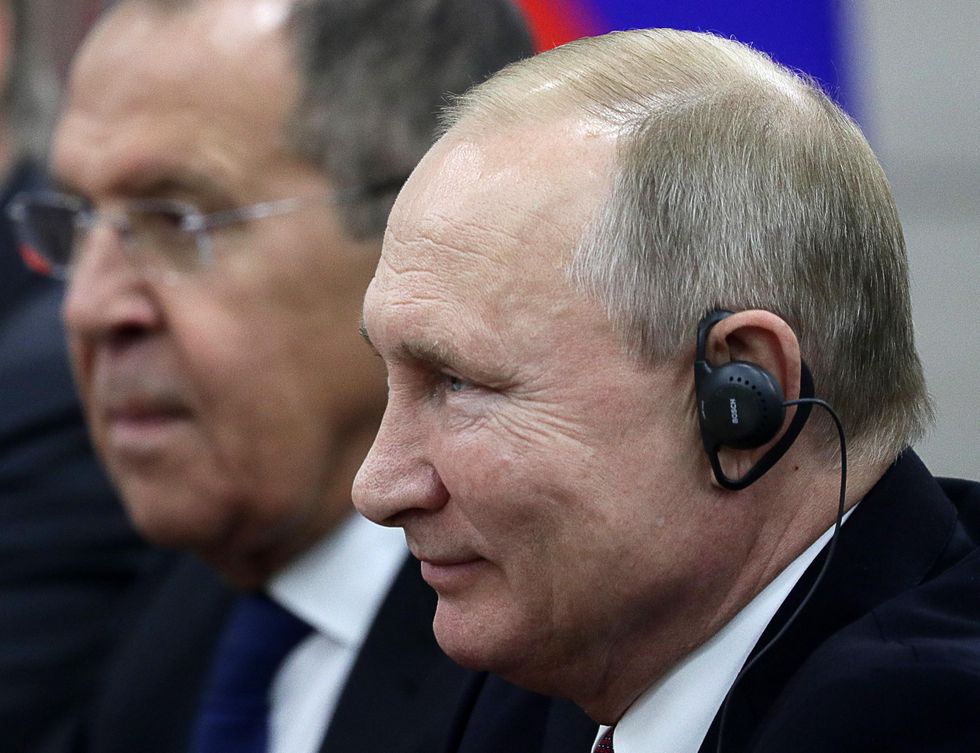 ​Russia's President Vladimir Putin (front), and Minister of Foreign Affairs Sergei Lavrov