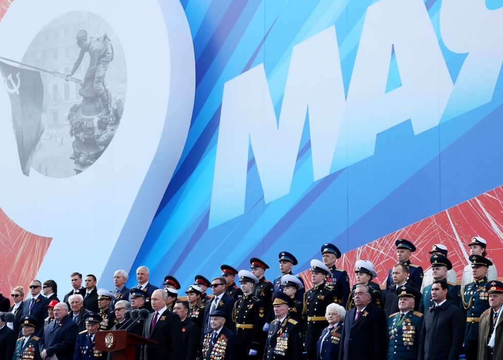 ​Russia's President Vladimir Putin stands behind a rostrum during a Victory Day parade